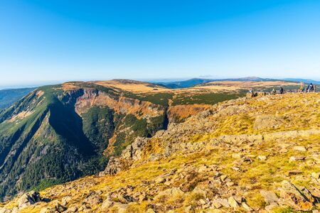 Studnicni Mountain and Giant Valley, Czech: Obri dul, on autumn sunny day in Krkonose - Giant Mountains, Czech Republic. View from lookout point on Snezka Mountain.の写真素材
