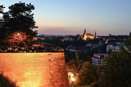 Walkway on Vysehrad fortification walls illuminated by street lamps by night. Prague, Czech Republic.の写真素材