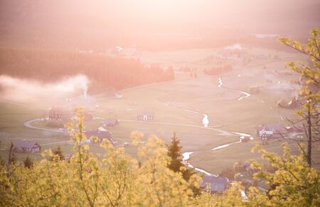 Jizerka village at sunset time. View from Bukovec Mountain, Jizera Mountains, Czech Republic.の写真素材