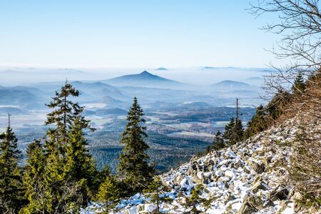 Ralsko Mountain rising from the mist. Weather temperature inversion in Central Bohemian Uplands, Czech Republic.の写真素材