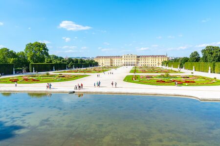 VIENNA, AUSTRIA - 23 JULY, 2019: Schonbrunn Palace, German: Schloss Schonbrunn, and Great Parterre - French Garden with beautiful flower beds, Vienna, Austriaのeditorial素材