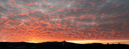 Silhouette of Jested mountain at sunset time with beautyifully illuminated evening sky, Liberec,...
