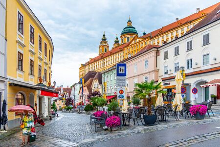 MELK, AUSTRIA - JULY 21, 2019: Restaurants with gardens on Town Hall Square on sunny summer day, Melk, Austria.のeditorial素材