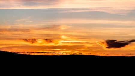 Dramatic colorful sunset sky. Sunny evening panoramic background.の写真素材