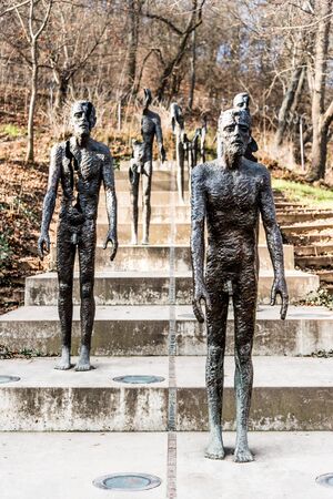 PRAGUE, CZECH REPUBLIC - FEBRUARY 2, 2020: Memorial to the Victims of Communism in Prague. Created by Czech sculptor Olbram Zoubek. Set of statues commemorating victims of Communism located under Petrin Hill near Ujezd, Prague.のeditorial素材