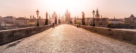 Morning on Charles Bridge, Czech: Karluv most. Hazy sunrise daybreak. Praha, Czech Republic.の写真素材