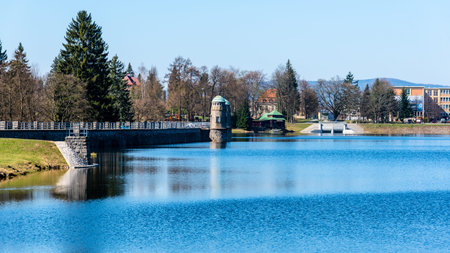 Mseno Reservoir with old stone dam on sunny day. Jablonec nad Nisou, Czech Republic.