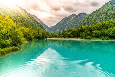 Klamsee - mountain water reservoir above Kaprun town with bright turquoise blue water, Austria.