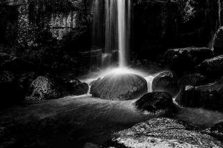 Waterfall of Jedlova. Small waterfall with mossy granite rocks. Jizera Mountains, Northern Bohemia,...