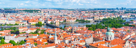 Prague City Panorama - view of red rooftops of Lesser Town and bridges over Vltava River on sunny summer day, Prague, Czech Republicの写真素材