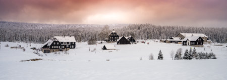 Winter in Jizera Mountains. Cloudy evening in Jizerka Village, Czech Republicの写真素材