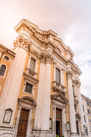 Church of Saints Ambrose and Charles Borromeo, Italian: SantAmbrogio e Carlo al Corso. Front view from Via del Corso, Rome, Italyの写真素材