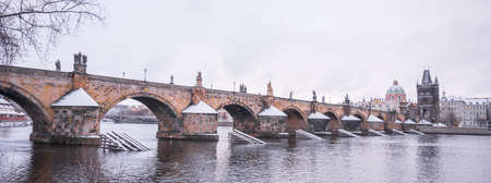 Historical Charles Bridge, Czech: Karluv most, over Vltava River in winter. Prague, Czech Republic.の写真素材