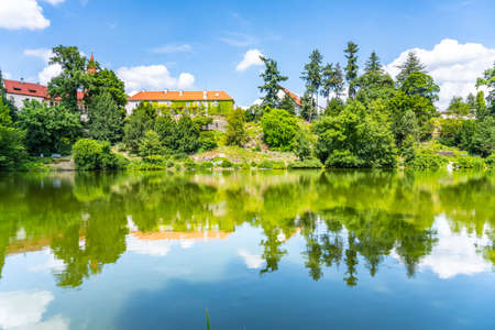 Pruhonice castle and natural park landscape with garden lake on sunny summer day, Pruhenice, Czech Republic.の写真素材
