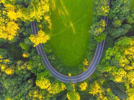 Asphalt road in rural landscape from aboveの写真素材