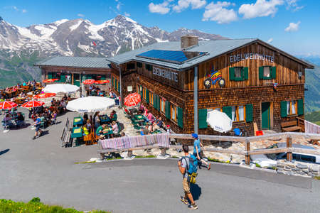 GROSSGLOCKNER HOCHALPENSTRASSE, AUSTRIA - JULY 28, 2020: Many people at Edelweisshutte - wooden mountain hut near at Grossglockner alpine road. Hohe Tauern National Park, Austriaのeditorial素材