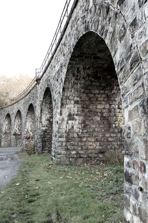 Old stone arched railroad bridgeの写真素材