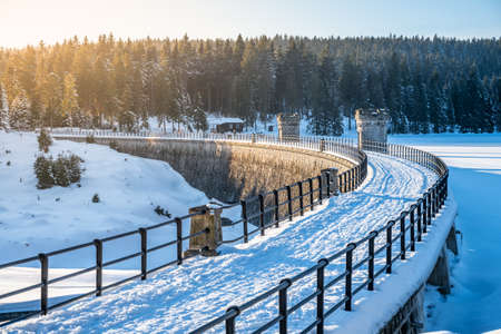Sunny winter evenign at water damの写真素材
