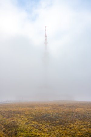 The broadcasting and observation tower on Praded Mountain shrouded in clouds. Hruby Jesenik, Czech Republic.の写真素材