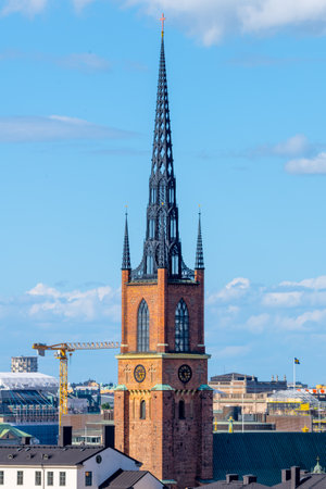 Pointed church tower on the island of Riddarholmen. Part of the former medieval abbey in Stockholm, Sweden. Burial site of most Swedish kings from the 17th century until 1950の写真素材