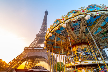 Historical Carousel of the Eiffel Tower. Morning photography at sunrise time. Paris, France