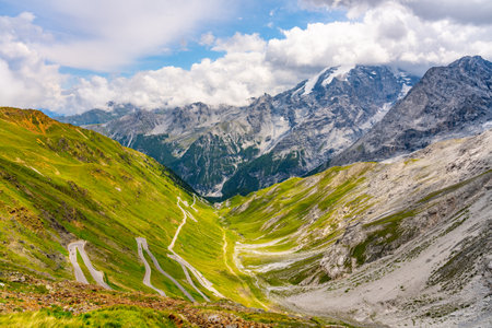 Stelvio pass serpentines with Ortler mountain on background. Asphalt road high in the Italian Alps, Italyの写真素材