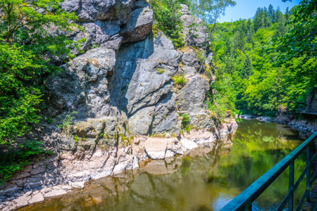 Wooden bridge pathway above Jizera River. Rieger Trail between Semily and Spalov. Czechiaの写真素材