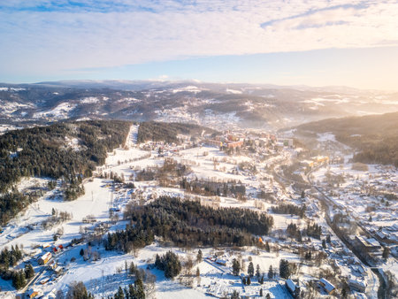 Tanvald in wintertime. Small town in Jizera Mountains, Czechia. Aerial photography from above.の写真素材