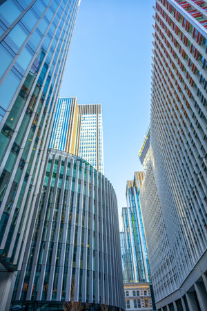Skyscrapers dominate the urban landscape of London City, reflecting a mix of contemporary...