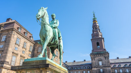 Equestrian statue of Christian IX stands prominently outside Christiansborg Palace in Copenhagen, Denmark. The statue showcases historical significance and architecture of the area.の写真素材