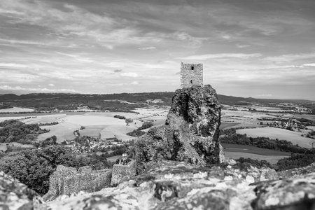 Trosky Castle ruins stand atop a rocky formation, offering a stunning view of the surrounding countryside in Bohemian Paradise, Czechia.の写真素材