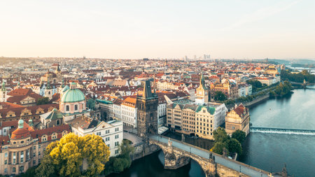 Charles Bridge stretches across the Vltava River, connecting the Old Town and Lesser Town. The Old Town Bridge Tower stands majestically, surrounded by stunning architecture and vibrant history.の写真素材