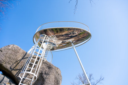 Located near Tanvald in the Jizera Mountains, Sipka lookout platform provides breathtaking panoramic views. Visitors can climb the stairs to enjoy the serene landscape on a clear day.の写真素材