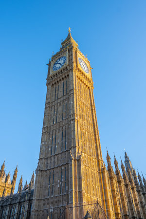 The iconic clock tower known as Big Ben rises majestically in London. Bathed in golden sunlight, it...