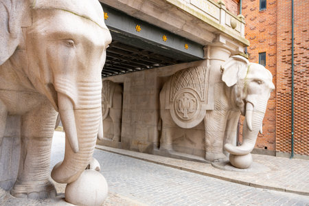 The Elephant Gate features striking stone sculptures of elephants that welcome visitors to the brewery in Copenhagen, Denmark. This architectural marvel blends art and history beautifully.の写真素材