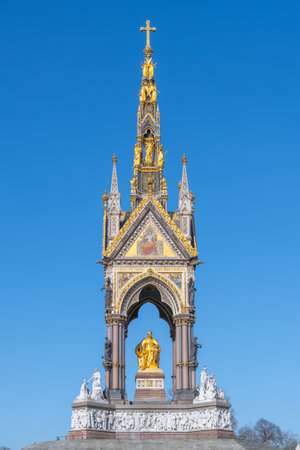 The Albert Memorial showcases intricate Gothic architecture with a golden statue of Prince Albert at its center. This landmark is located in Kensington Gardens, attracting many visitors.の写真素材