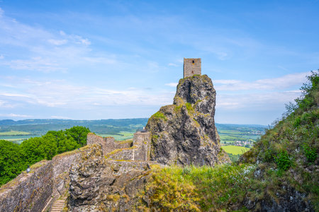 Trosky Castle ruins rise majestically atop a rocky outcrop in Bohemian Paradise, Czechia. The structure offers stunning views of the surrounding lush landscape and historical significance.の写真素材