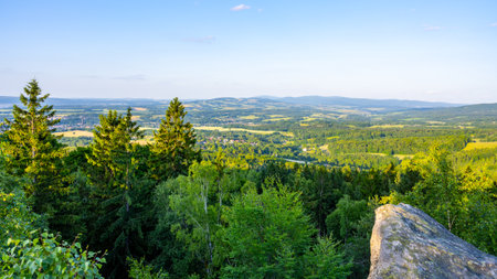 At dusk, the Popov Cliffs in the Lusatian Mountains offer a breathtaking view. Surrounding forested hills and valleys create a tranquil atmosphere perfect for evening exploration.の写真素材