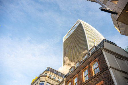 Fenchurch Building, known as the Walkie-Talkie, stands out against a clear sky in the heart of...
