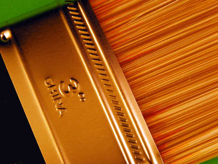 A paintbrush against a green background.の写真素材