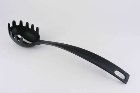 A pasta fork against a gray background.の写真素材