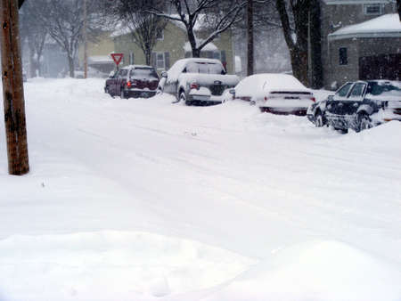 A SUV preparing to embark on a snow-packed road.の写真素材