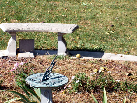 A sundial on a pedestal in briight sunlight.の写真素材