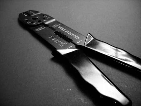 A black and white photo of a wire stripper tool.の写真素材