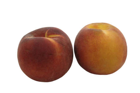 A pair of peaches isolated against a white background.の写真素材