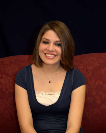 A pretty teenager with brunette hair.の写真素材