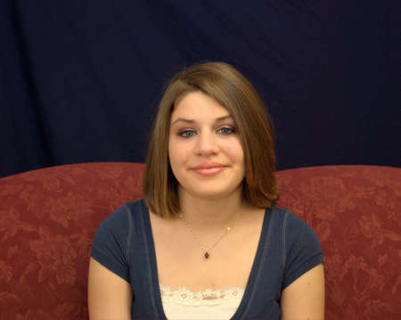 A pretty teenager with brunette hair.の写真素材