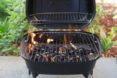 charcoal grill with flames close upの写真素材