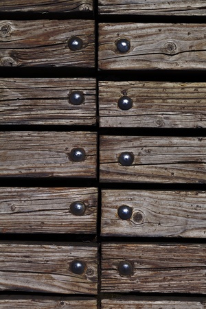 brown wooden texture background with rivets close upの写真素材