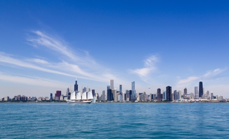 summer Chicago skyline with tallship and airshipの写真素材